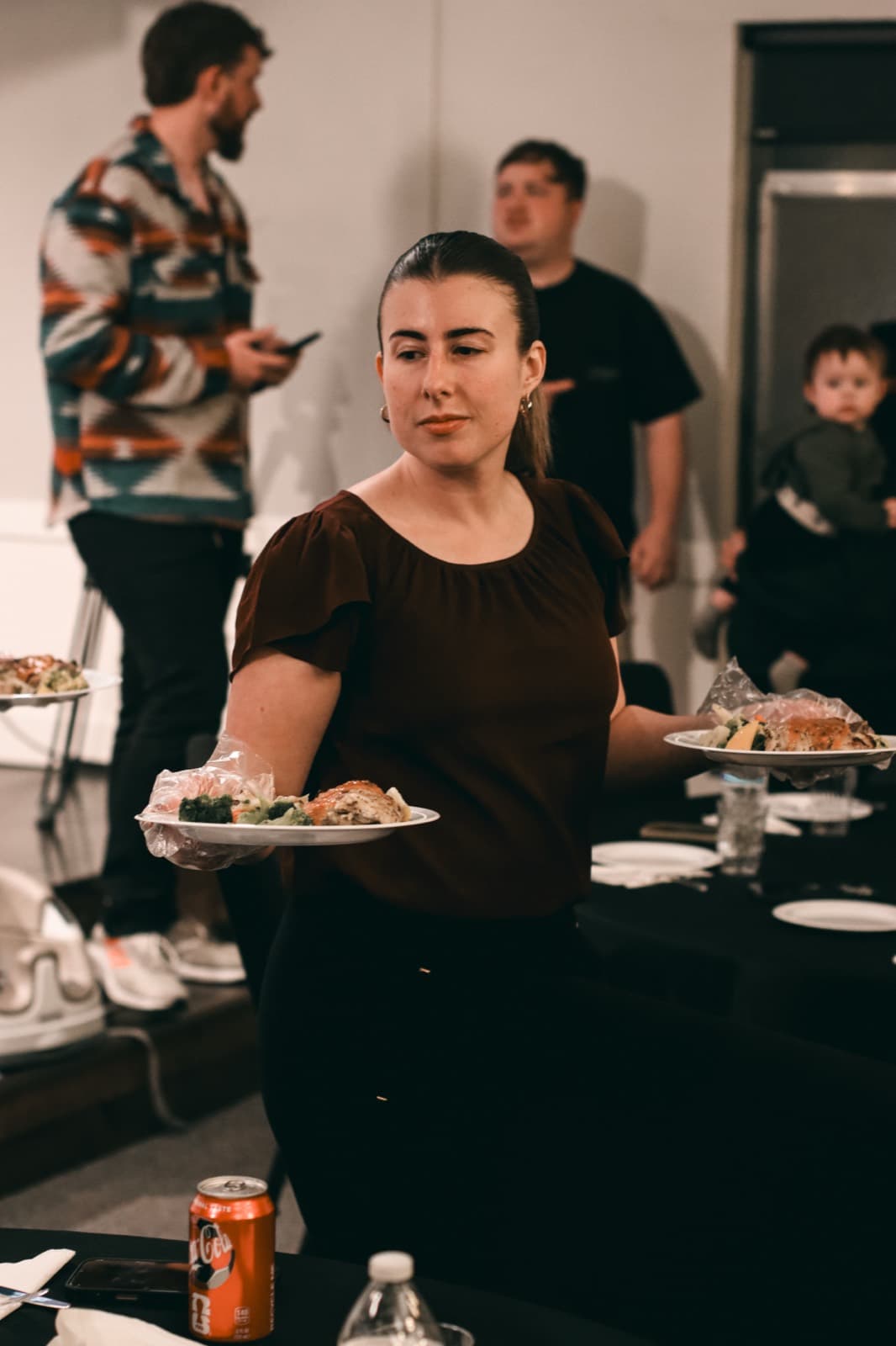 Guest carrying a plated meal at a catered event